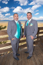 Two men in suits and ties standing next to each other.