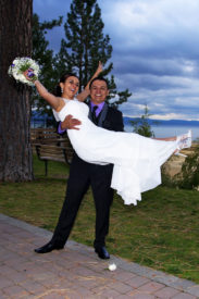 A newly married couple posing for the camera.