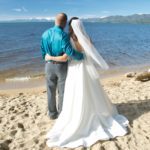 A man and woman standing on the beach