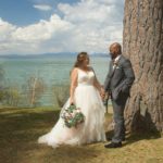 A bride and groom standing next to each other.