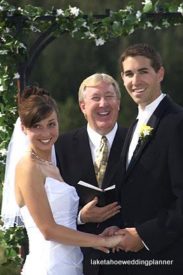 A man and two women standing next to each other.