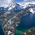 A view of the mountains and water from above.