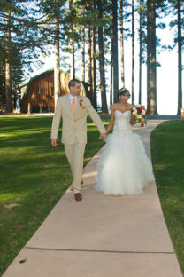 A man and woman walking down the aisle.