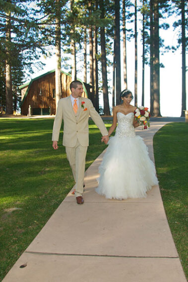 A man and woman walking down the aisle.